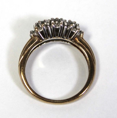 Lot 644 - A 9ct yellow gold ring set three graduated...