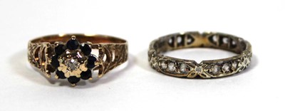 Lot 647 - A 9ct yellow gold cluster ring set diamond and...