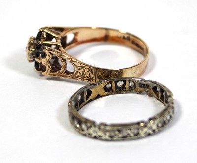 Lot 647 - A 9ct yellow gold cluster ring set diamond and...