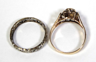 Lot 647 - A 9ct yellow gold cluster ring set diamond and...