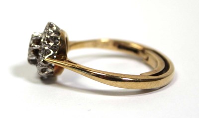 Lot 649 - A 9ct yellow gold cluster ring set brilliant...