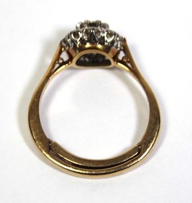 Lot 649 - A 9ct yellow gold cluster ring set brilliant...