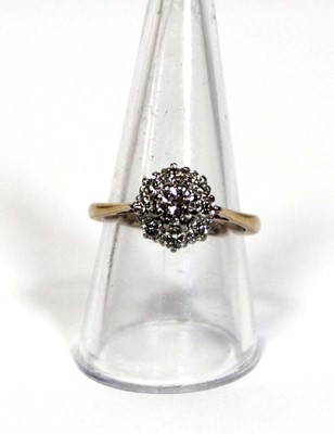 Lot 649 - A 9ct yellow gold cluster ring set brilliant...