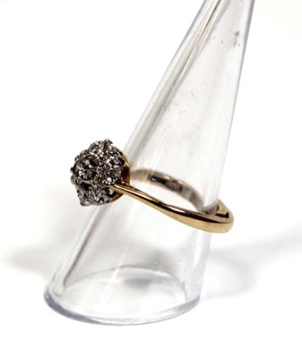 Lot 649 - A 9ct yellow gold cluster ring set brilliant...