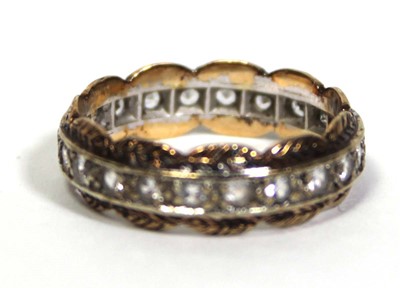 Lot 650 - A 9ct two-colour gold eternity ring set paste...