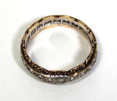 Lot 650 - A 9ct two-colour gold eternity ring set paste...