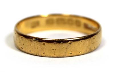 Lot 651 - A 22ct yellow gold wedding band, London 1956,...