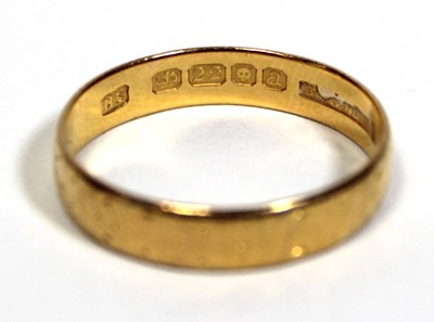 Lot 651 - A 22ct yellow gold wedding band, London 1956,...