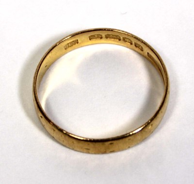Lot 651 - A 22ct yellow gold wedding band, London 1956,...