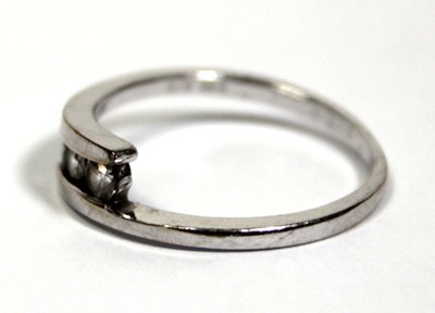 Lot 652 - An 18ct white gold ring set three clear paste...