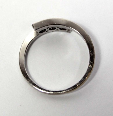 Lot 652 - An 18ct white gold ring set three clear paste...