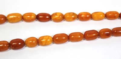Lot 655 - An amber type single strand graduated bead...