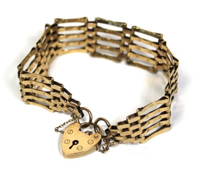 Lot 658 - A 9ct yellow gold five bar gatelink bracelet...