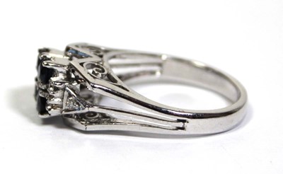 Lot 659 - An 18ct white gold ring set four small...