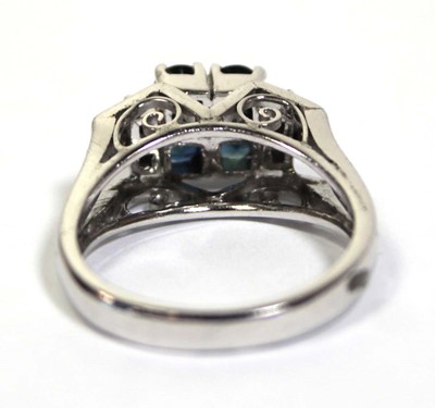 Lot 659 - An 18ct white gold ring set four small...