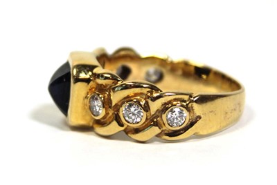 Lot 660 - An 18ct yellow gold ring set cabochon sapphire...