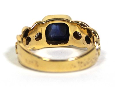 Lot 660 - An 18ct yellow gold ring set cabochon sapphire...