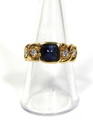 Lot 660 - An 18ct yellow gold ring set cabochon sapphire...