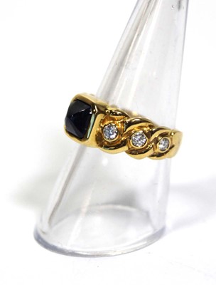 Lot 660 - An 18ct yellow gold ring set cabochon sapphire...