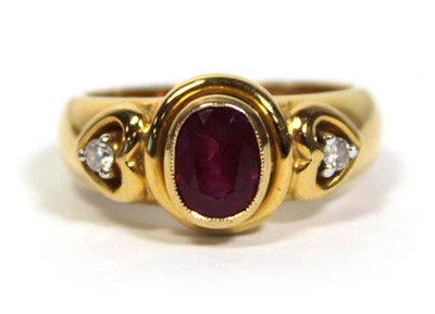 Lot 662 - A 18ct yellow gold ring set oval ruby in a...
