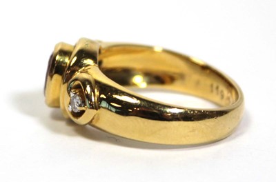 Lot 662 - A 18ct yellow gold ring set oval ruby in a...