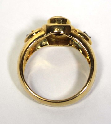 Lot 662 - A 18ct yellow gold ring set oval ruby in a...