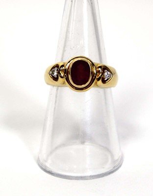 Lot 662 - A 18ct yellow gold ring set oval ruby in a...