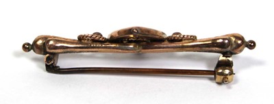 Lot 663 - A late Victorian 9ct yellow gold bar brooch of...