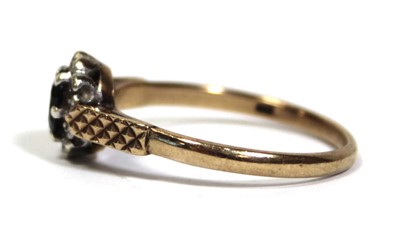 Lot 666 - A 9ct yellow gold cluster ring set oval...