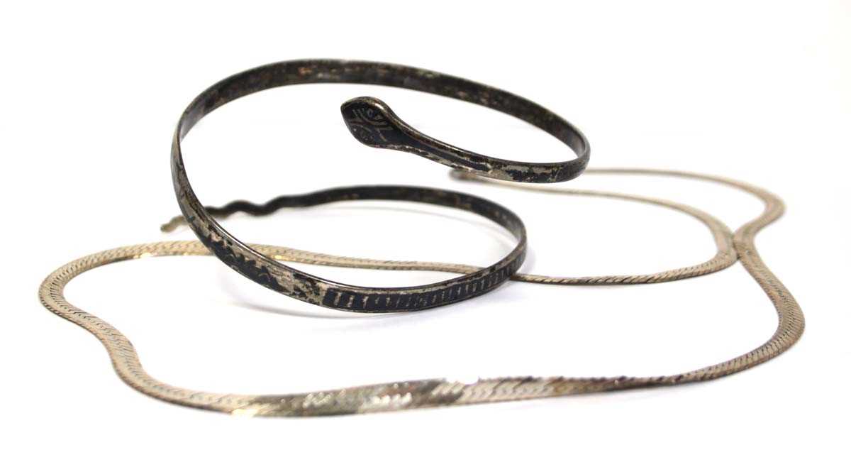 Lot 667 - A metalware and niellowork decorated slave...