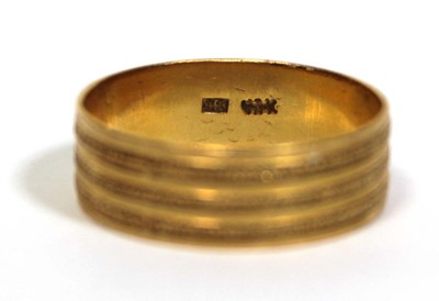 Lot 670 - A 22ct yellow gold textured wedding band, band...