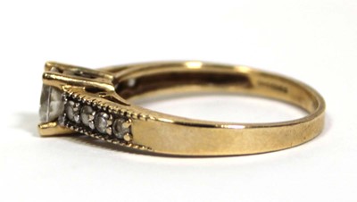 Lot 672 - A 14ct yellow gold ring set cubic zirconia,...