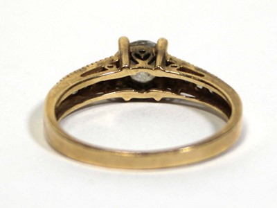Lot 672 - A 14ct yellow gold ring set cubic zirconia,...