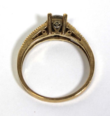 Lot 672 - A 14ct yellow gold ring set cubic zirconia,...