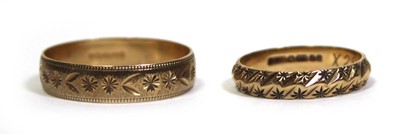 Lot 674 - Two 9ct yellow gold wedding bands, ring sizes...