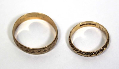 Lot 674 - Two 9ct yellow gold wedding bands, ring sizes...