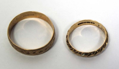 Lot 674 - Two 9ct yellow gold wedding bands, ring sizes...