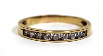 Lot 676 - A yellow metal half eternity ring set paste in...