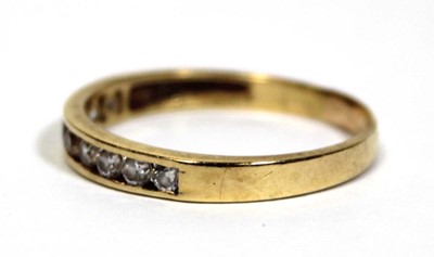 Lot 676 - A yellow metal half eternity ring set paste in...