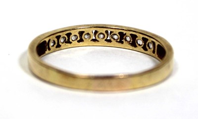 Lot 676 - A yellow metal half eternity ring set paste in...