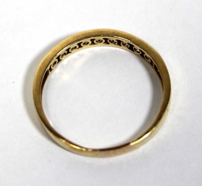 Lot 676 - A yellow metal half eternity ring set paste in...