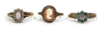 Lot 677 - Three 9ct yellow gold dress rings, one set...