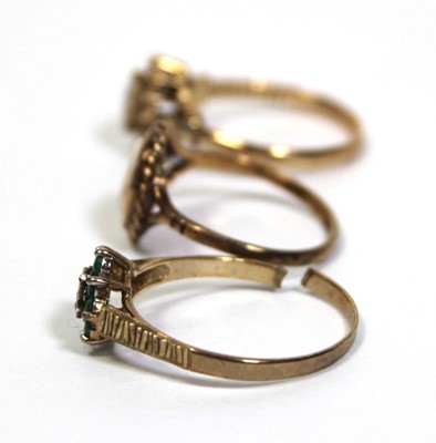 Lot 677 - Three 9ct yellow gold dress rings, one set...