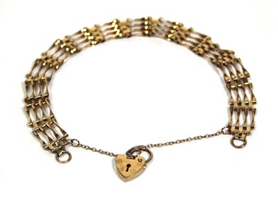 Lot 678 - A 9ct yellow gold four bar gatelink bracelet...
