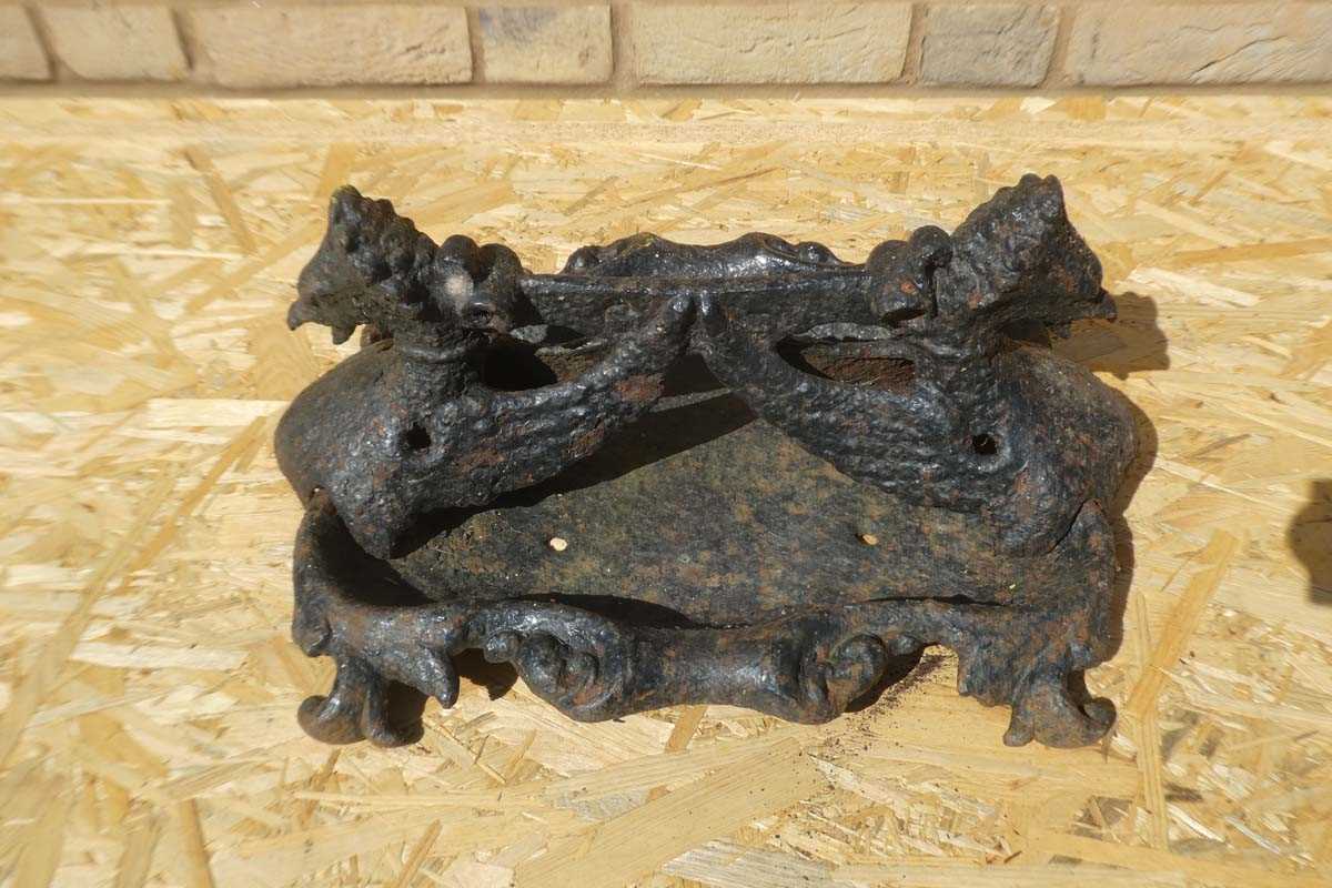 Lot A cast iron twin headed griffin themed boot...