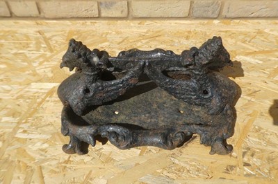Lot A cast iron twin headed griffin themed boot...