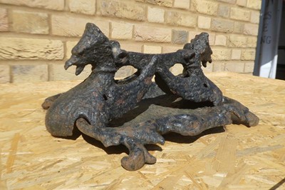 Lot A cast iron twin headed griffin themed boot...