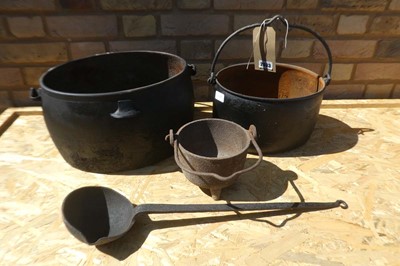 Lot 2 Cast Iron single handled Cauldrons together...