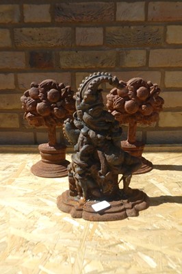 Lot Cast Iron "Punch" door stop together with 2...