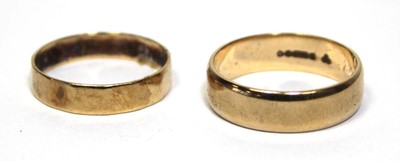 Lot 684 - Two 9ct yellow gold wedding bands, ring sizes...